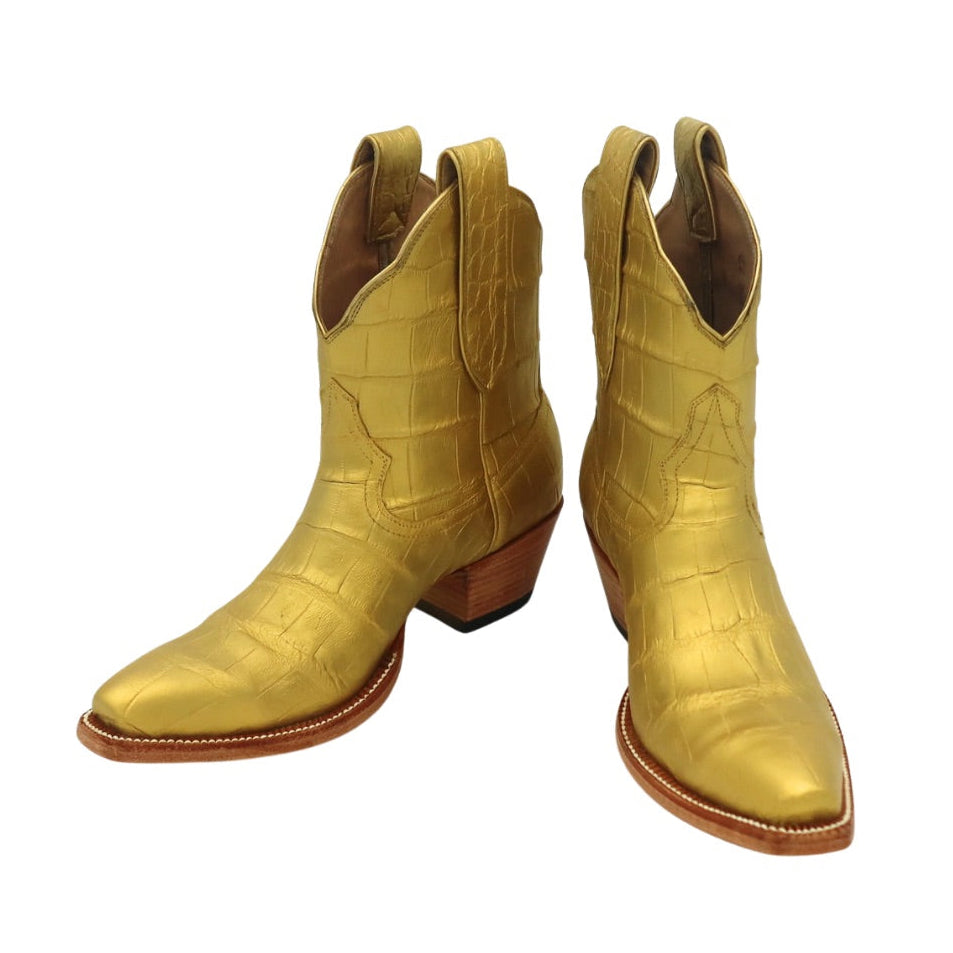 Pair of gold metallic alligator luxury cowgirl cowboy boot on a white background