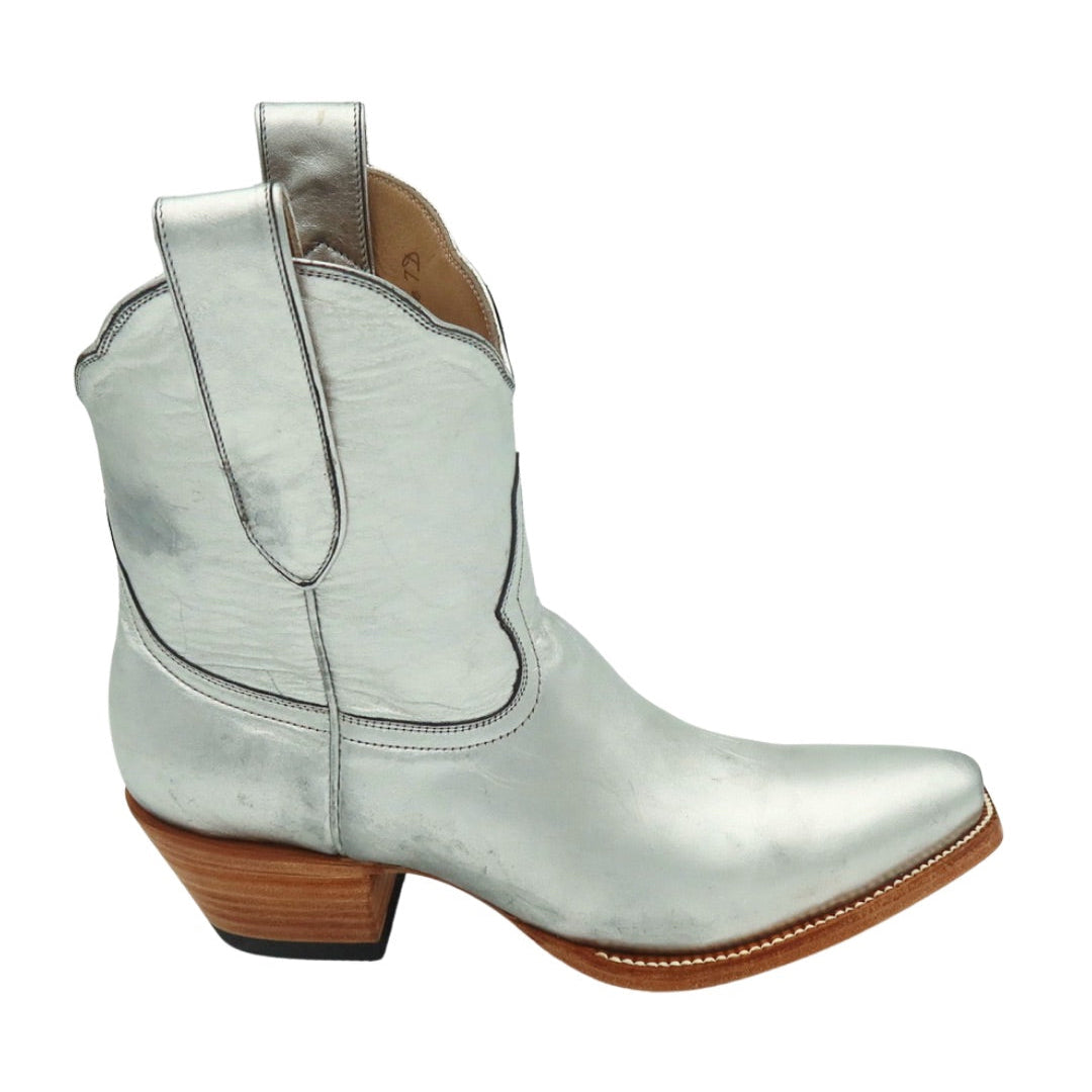 Silver cowboy boot with a brown sole on a white background
