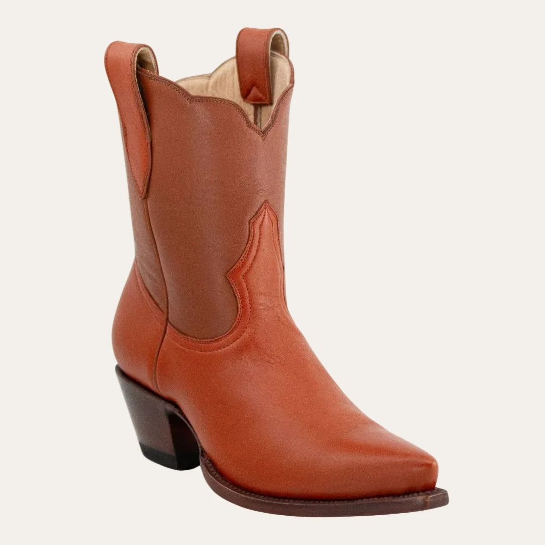 Brown leather cowboy boot on a white background