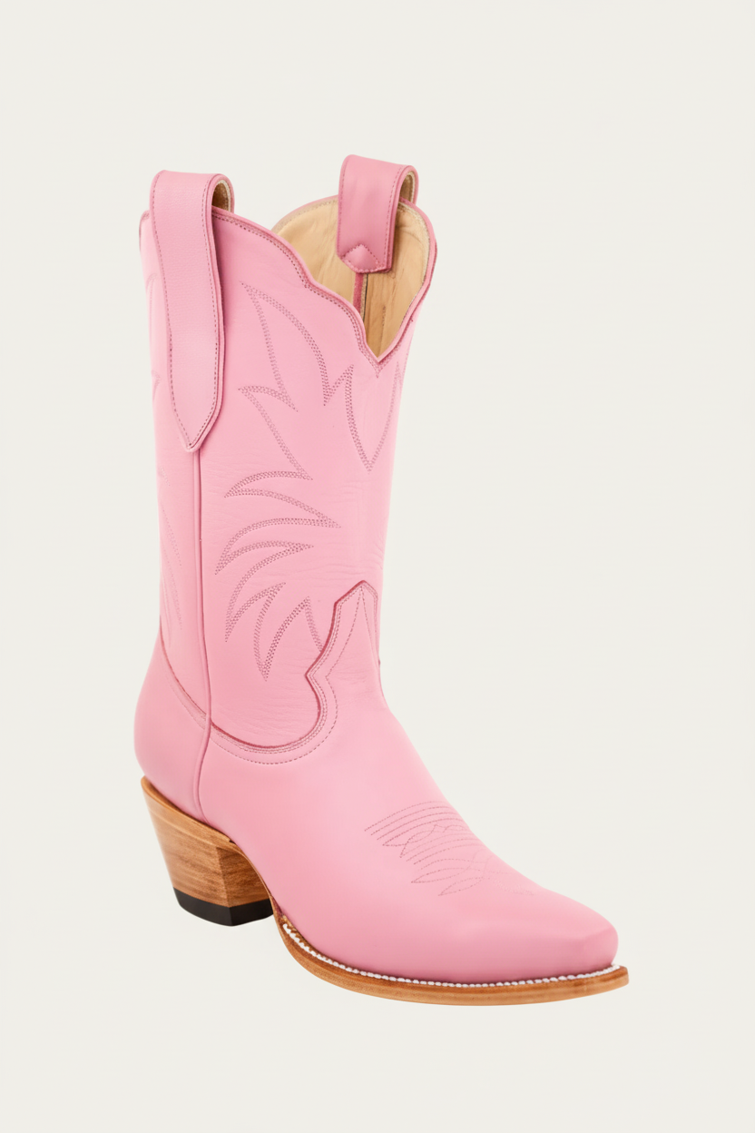 Pink cowboy boot with wooden heel and insole on a white background
