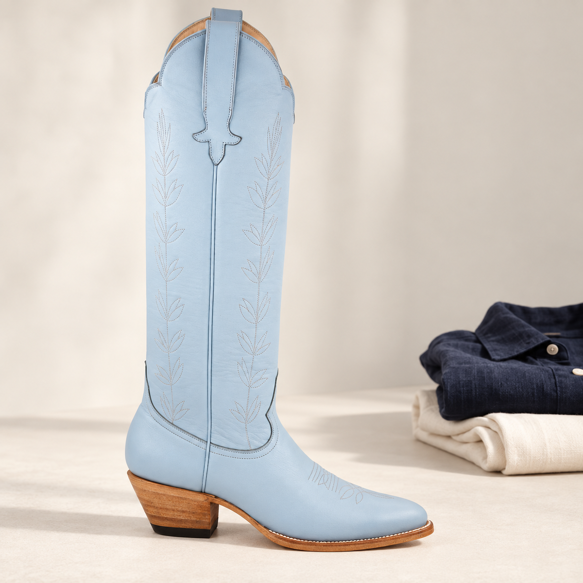 Powder Blue Vine | Studio wardrobe shelfie. AI-generated editorial image.