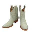 Pair of cream ivory off white  luxury cowgirl cowboy boot  alligator with brown soles on a white background