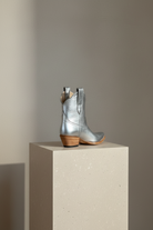 The Payton Boot — Silver Metallic — Detail view of premium calfskin texture and tonal stitching