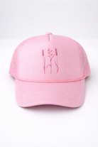 Pink cap with embroidered design on a white background