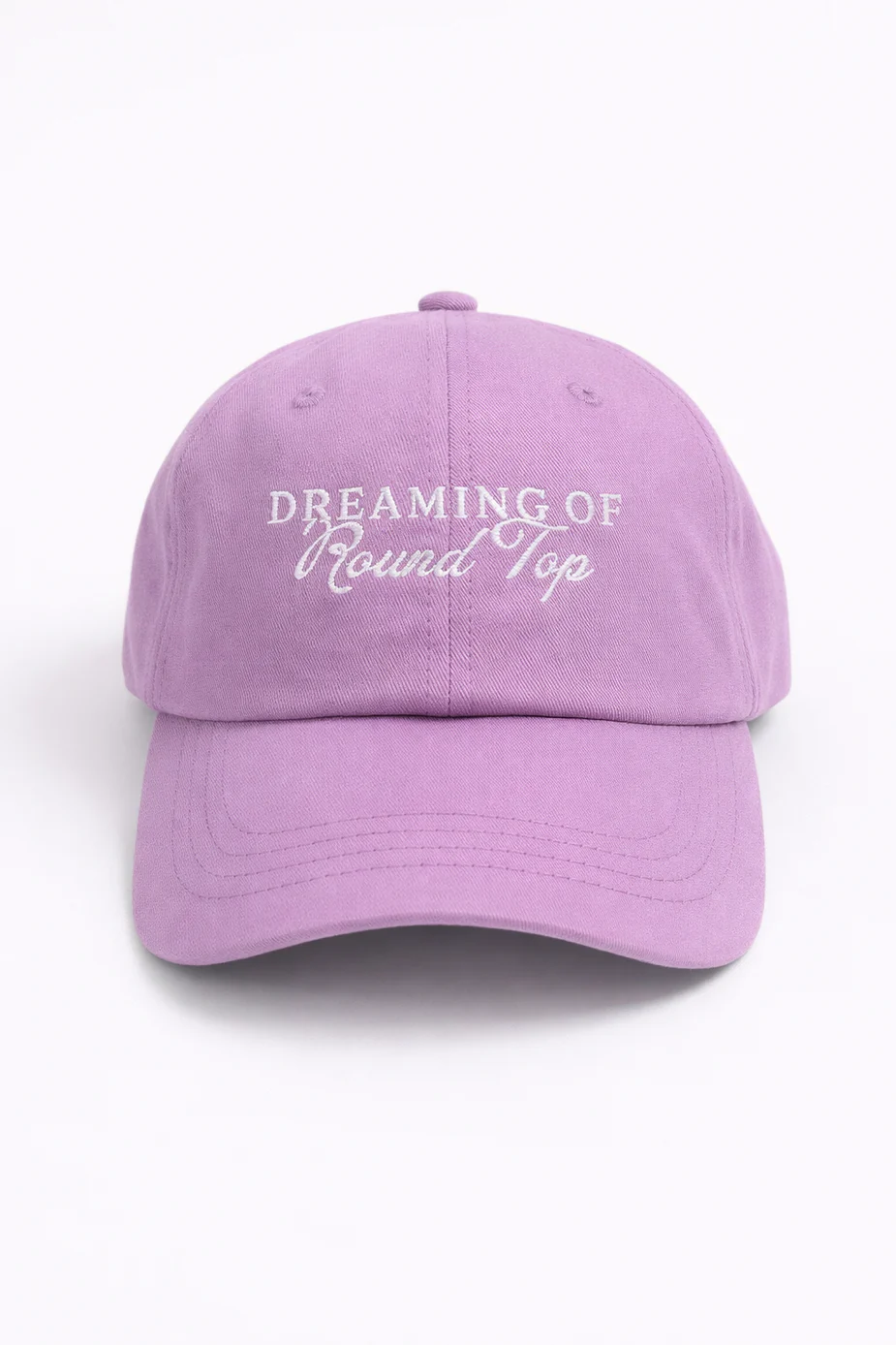 Front of the lavender Dreaming of Round Top cap with white embroidered lettering.