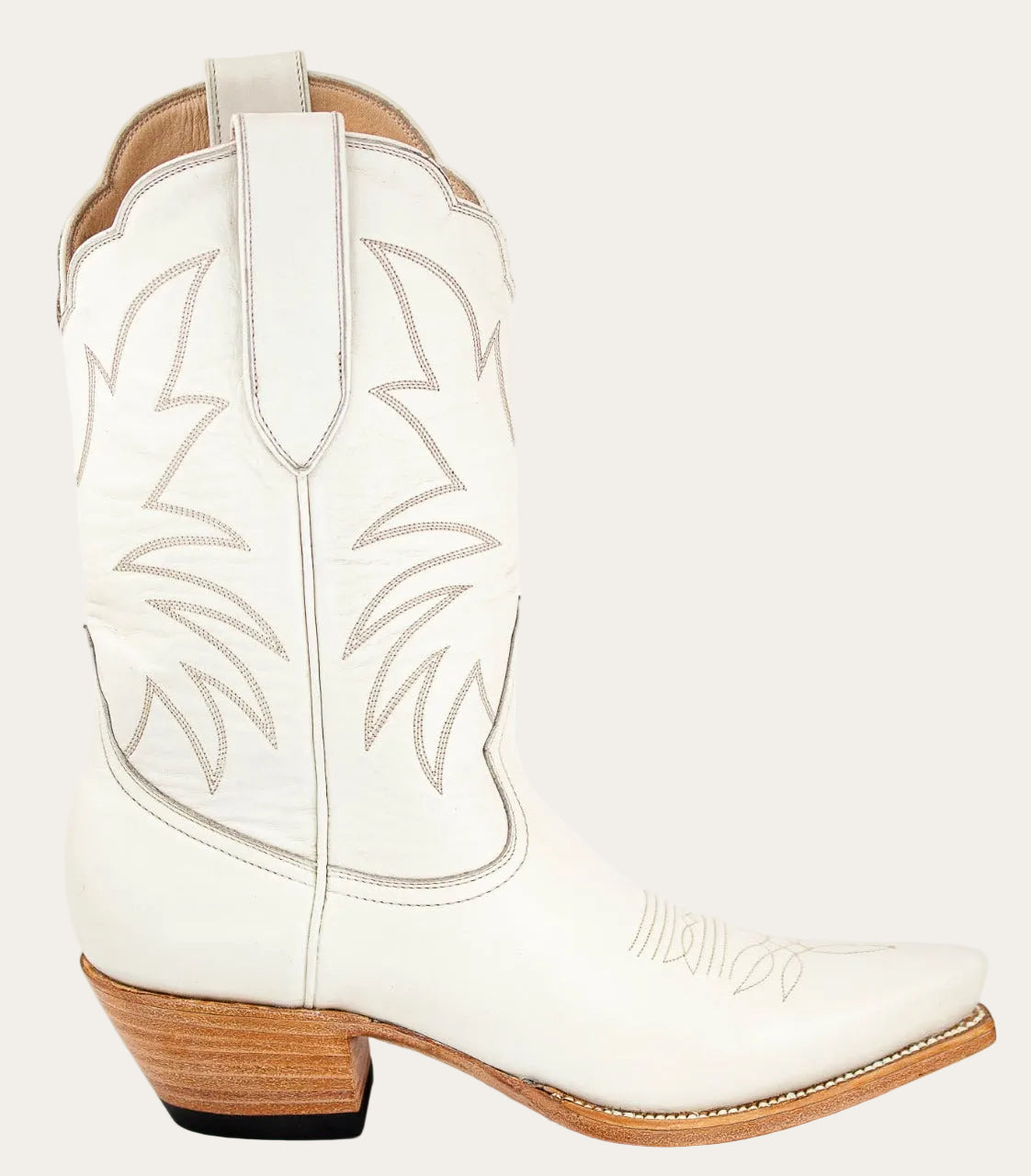 ivory cream bone White cowboy boot with brown sole on a white background