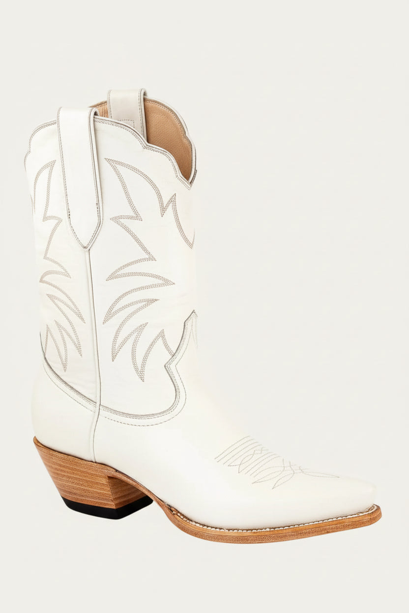 ivory cream bone White cowboy boot with brown sole on a white background