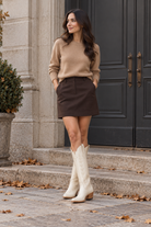 Autumn camel knit. AI-generated editorial image.