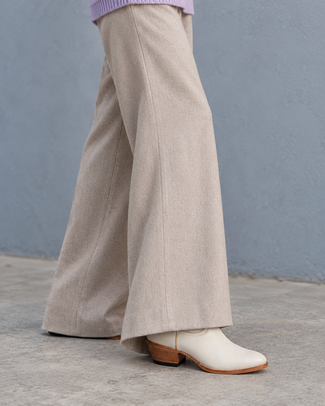 McCall Bone under fluid trousers. AI-generated editorial image.
