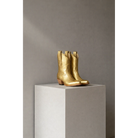 Gold Metallic Payton boots on a stone pedestal