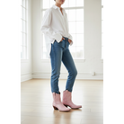 Petal Pink Payton boots styled with cuffed blue jeans and a white shirt.