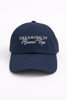 Front view of the navy Dreaming of Round Top cap.