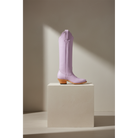 Lavender Georgia Tall boot, side view on a stone pedestal