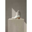 The Payton Boot — Putty Alligator — Side profile showing architectural silhouette and stacked leather heel