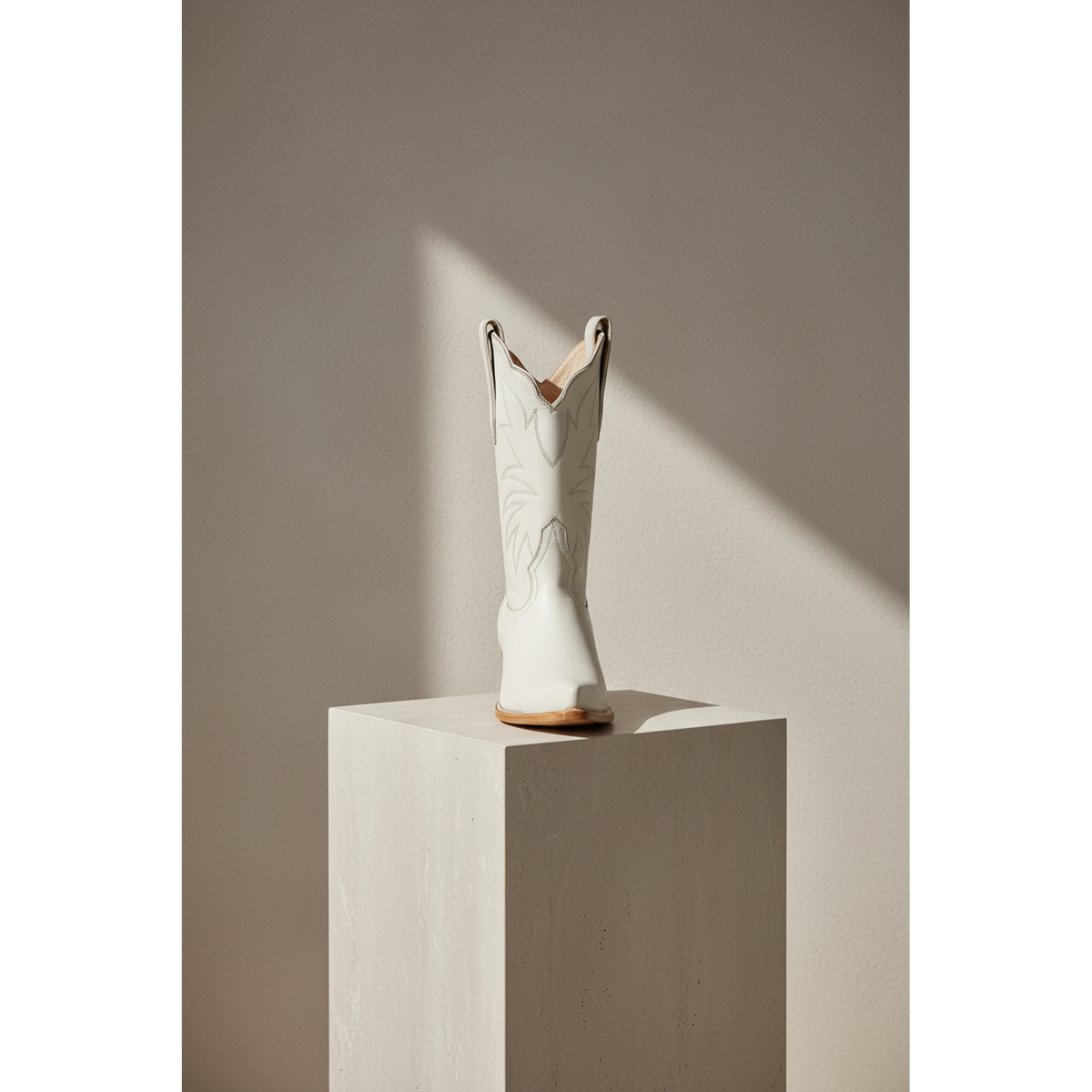 Front view of the Bone Marjorie Midi boot, showing its scalloped top and tonal stitching.