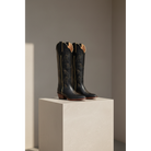 The Shooting Star Boot — Side profile showing architectural silhouette and stacked leather heel