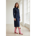 Woman wearing pink midi boots with a dark denim midi dress.